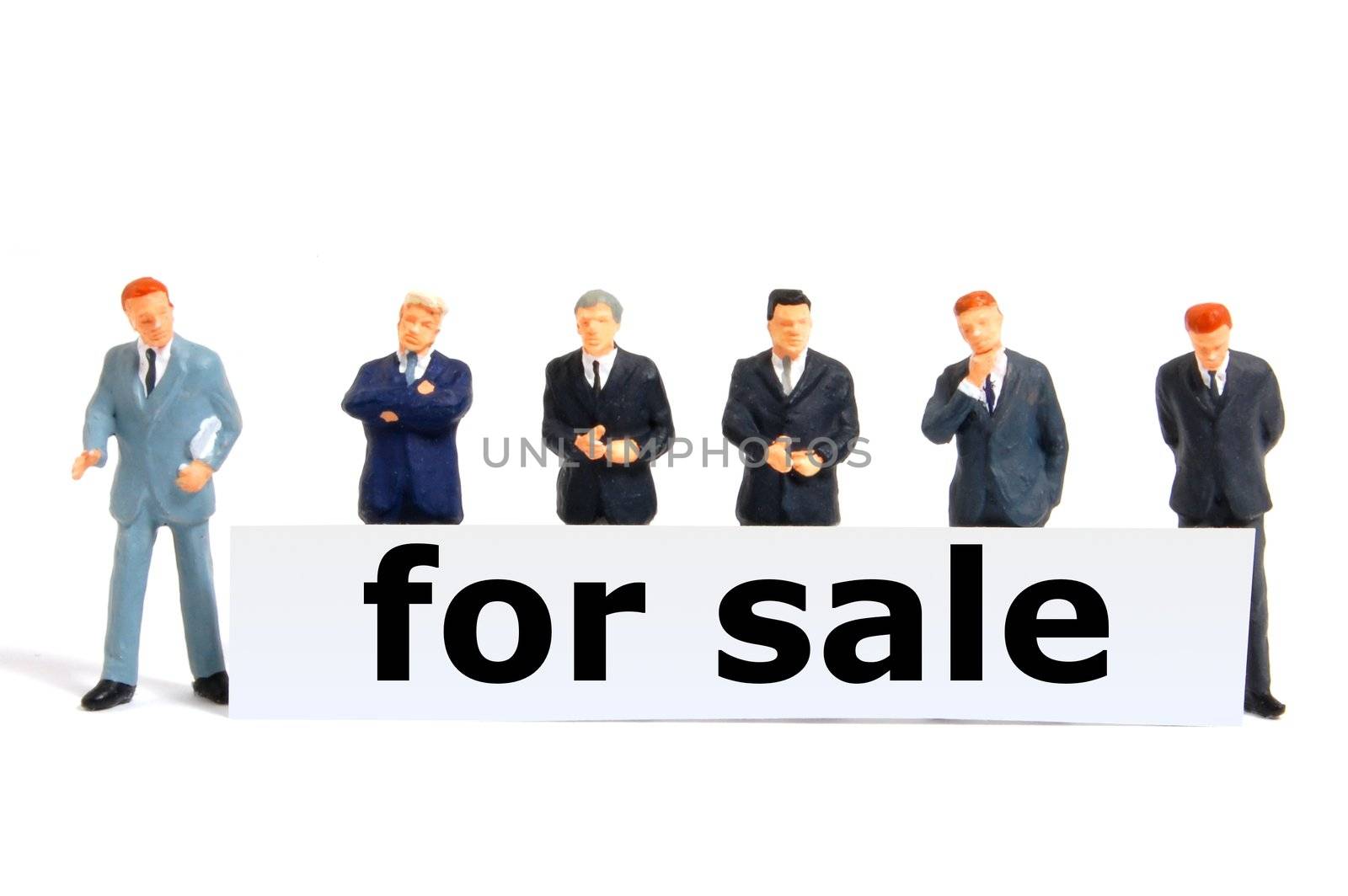for sale concept with toy business man isolated on white background