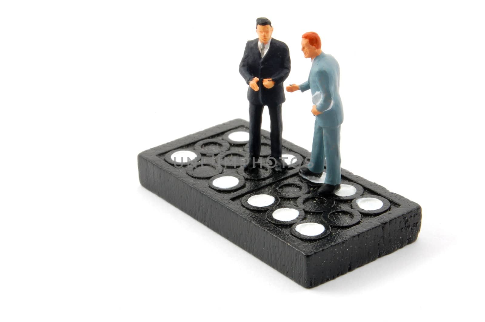 business man on domino isolated on white background