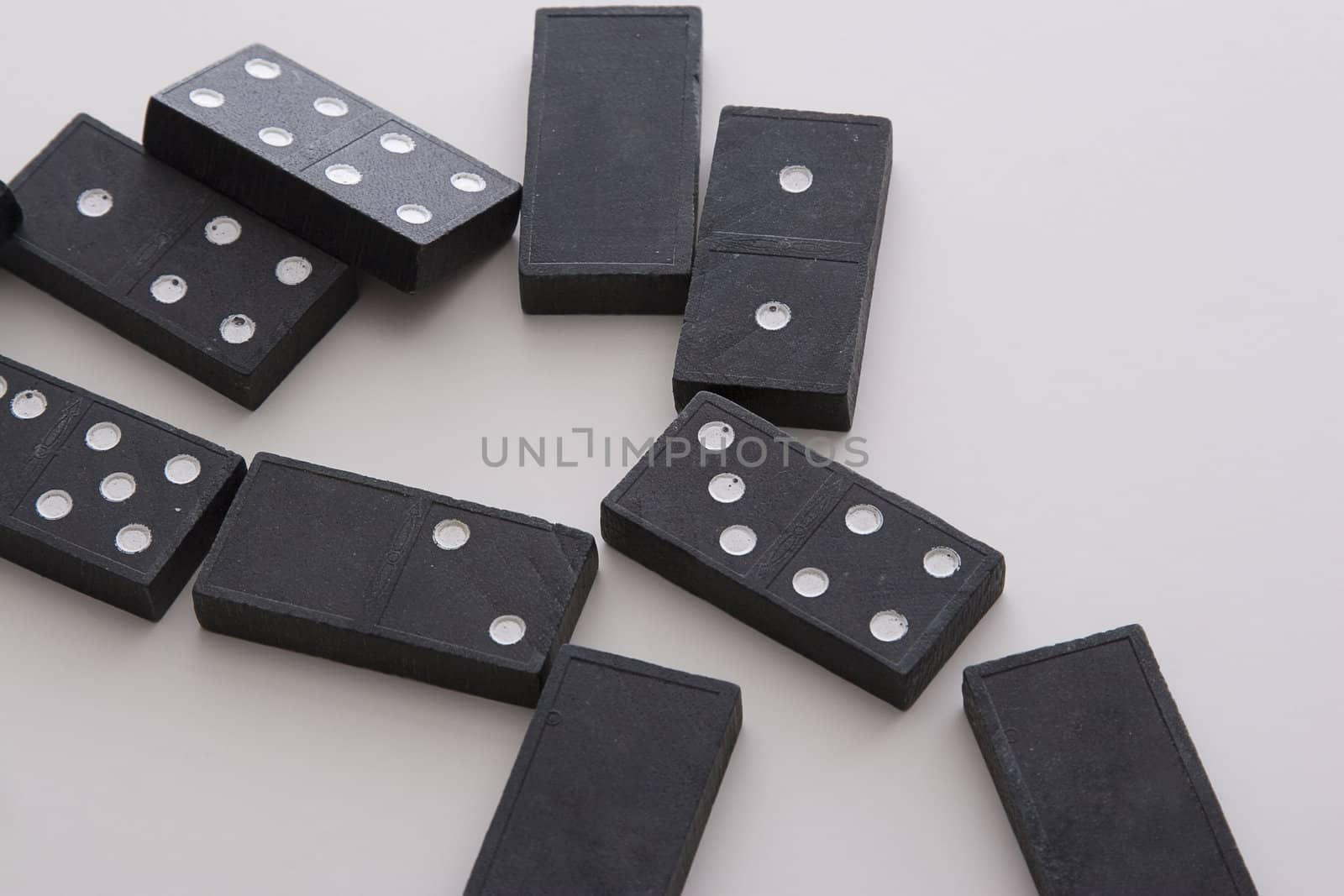 array of dominos fallen on a table