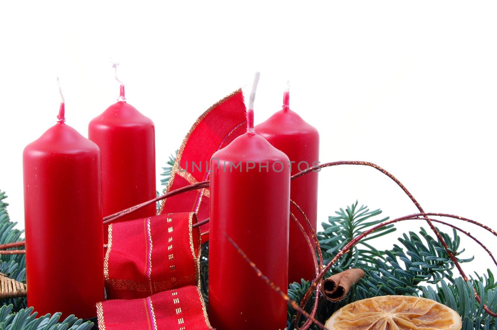 christmas wreath isolated on white background with red candles