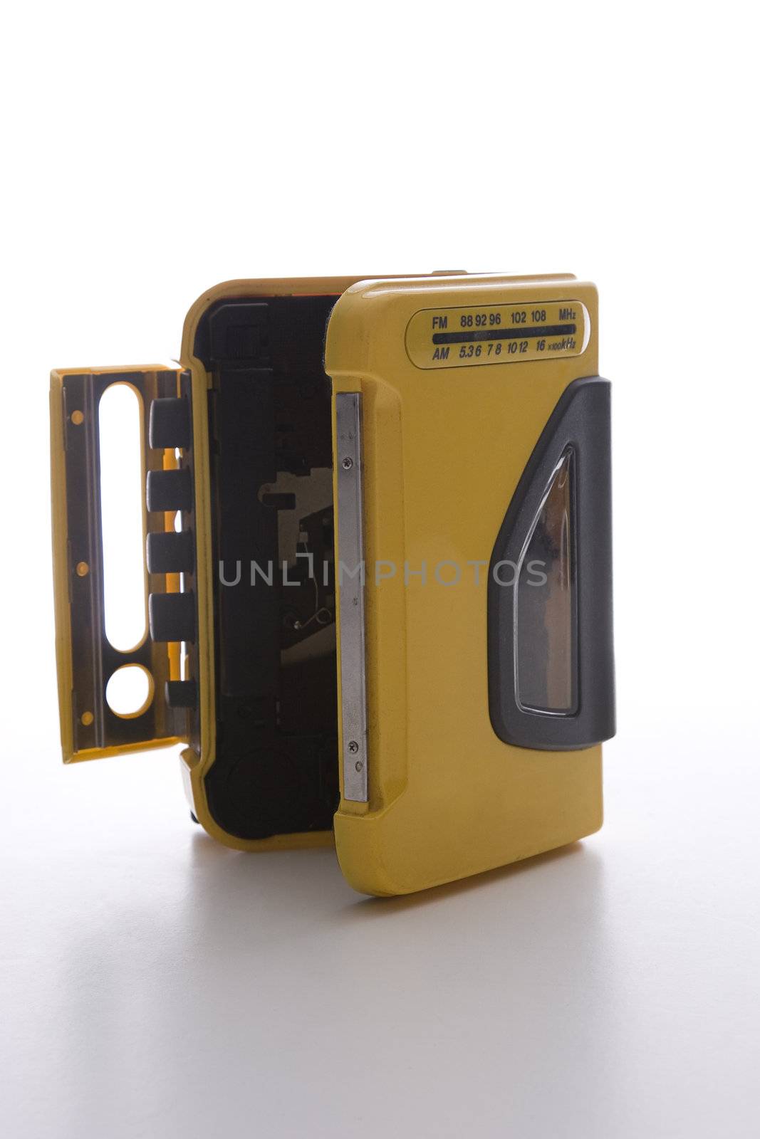vintage yellow cassette player with door open