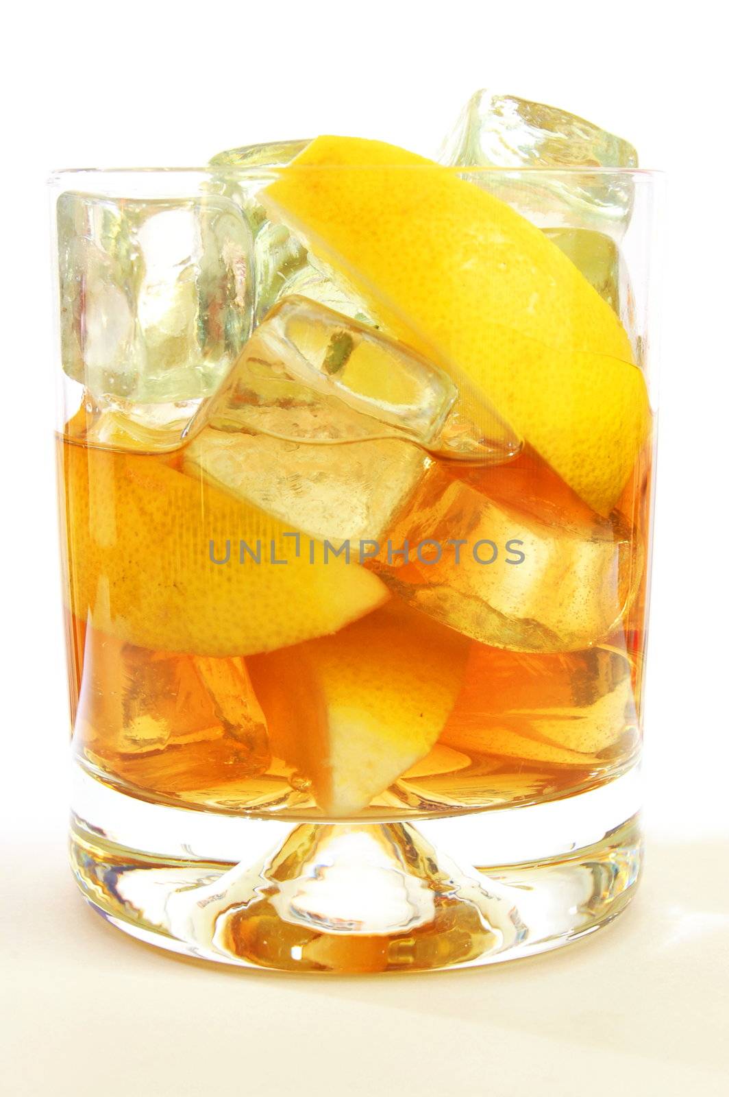 glass of whisky on the rocks isolated on white