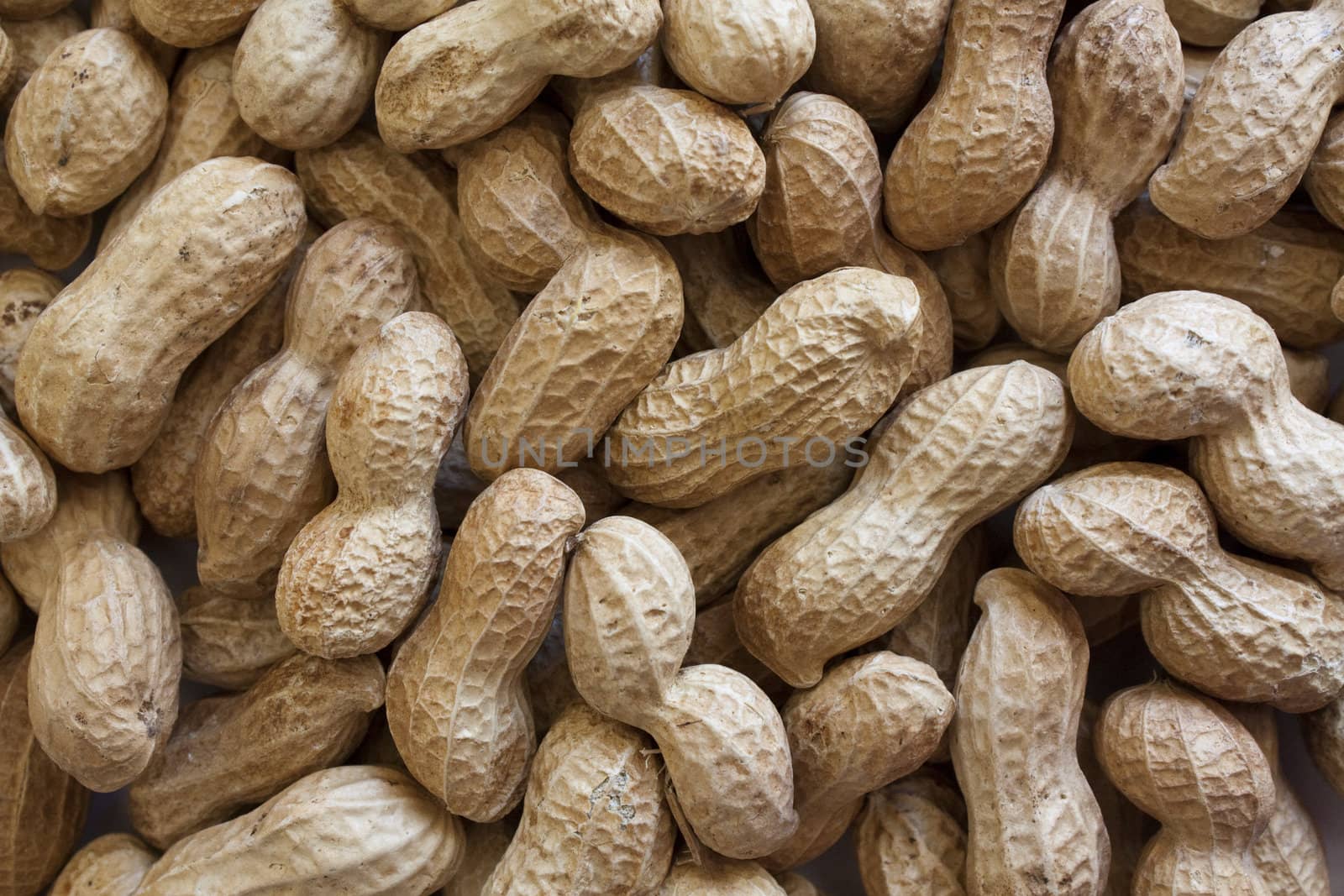 Background of raw peanuts in shell.