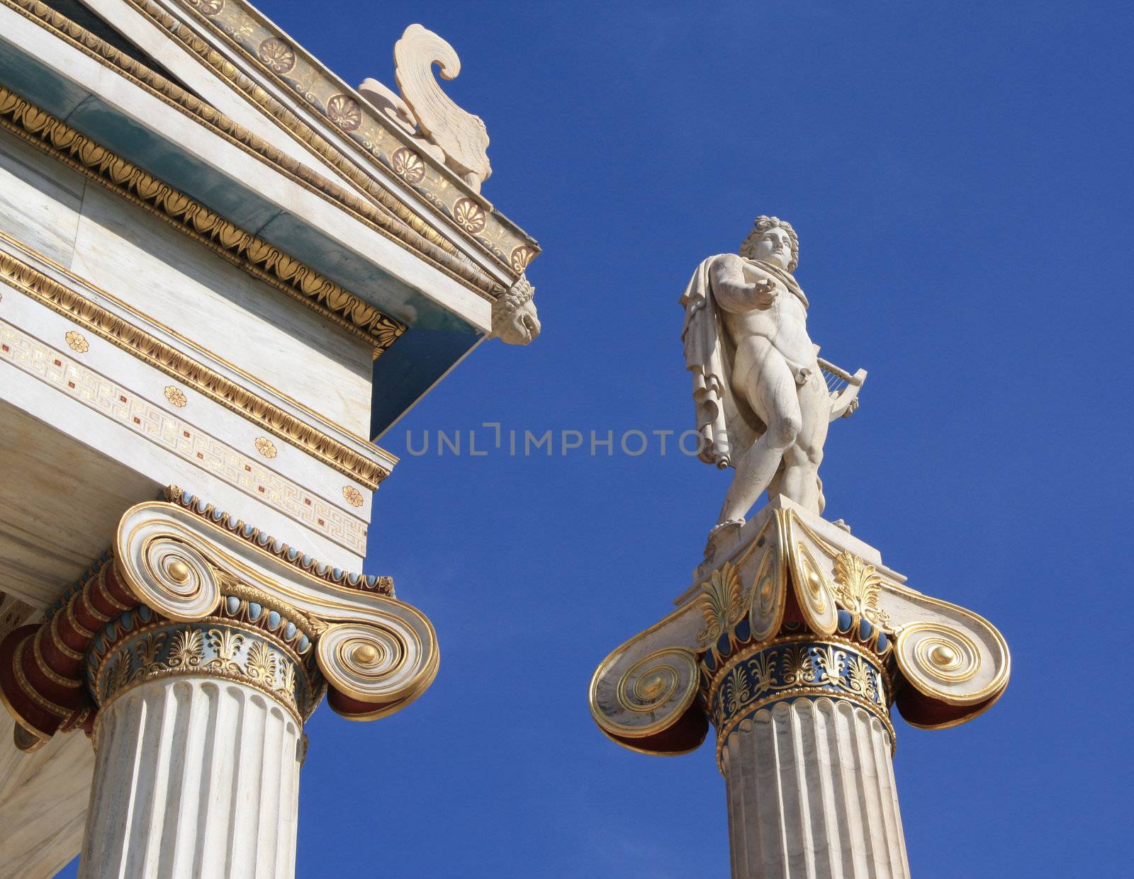 Neoclassical statue of ancient Greek good, Apollo, outside Academy of Athens, Greece. Apollo was the god of light and the sun, truth and prophecy, archery, medicine and healing, music, poetry and the arts. 