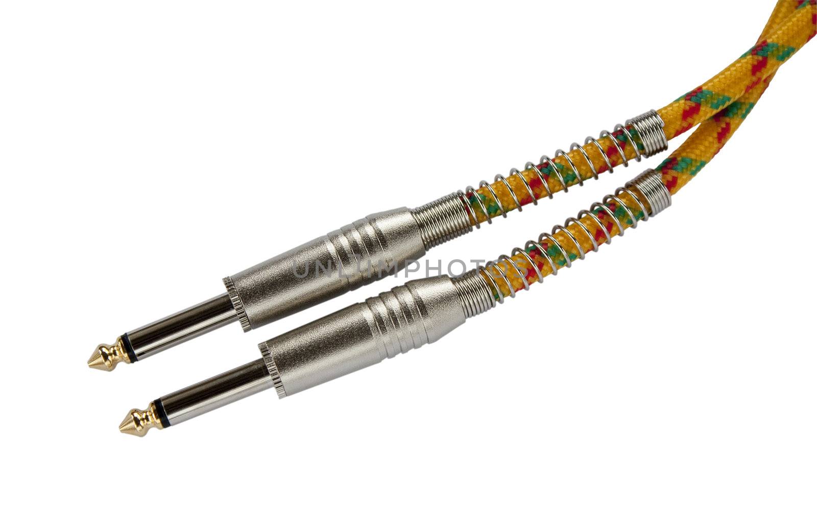 Tweed cable and chrome plugs for connecting musical instruments to amplifiers isolated on white background.