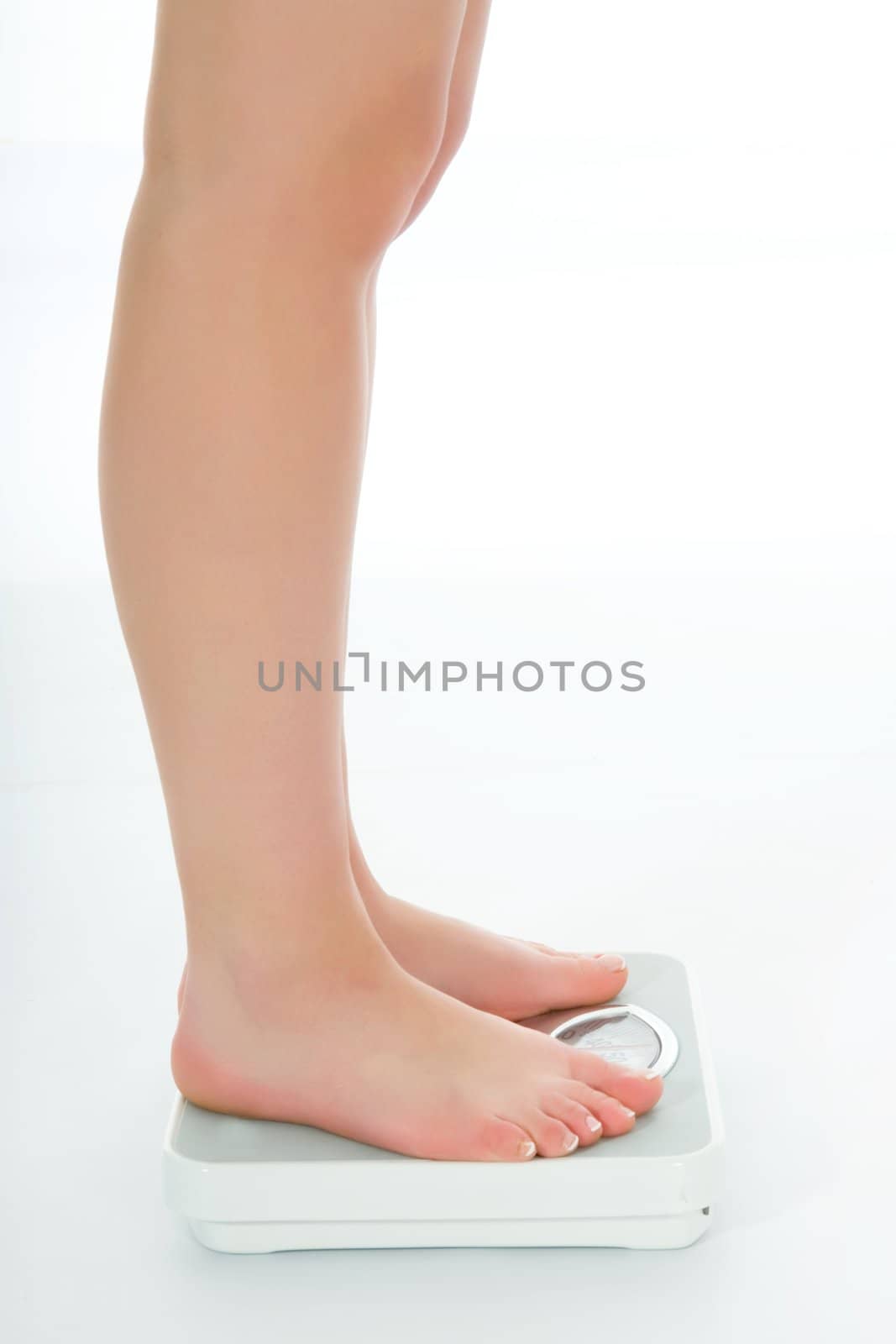 beautiful woman legs with  scales on white