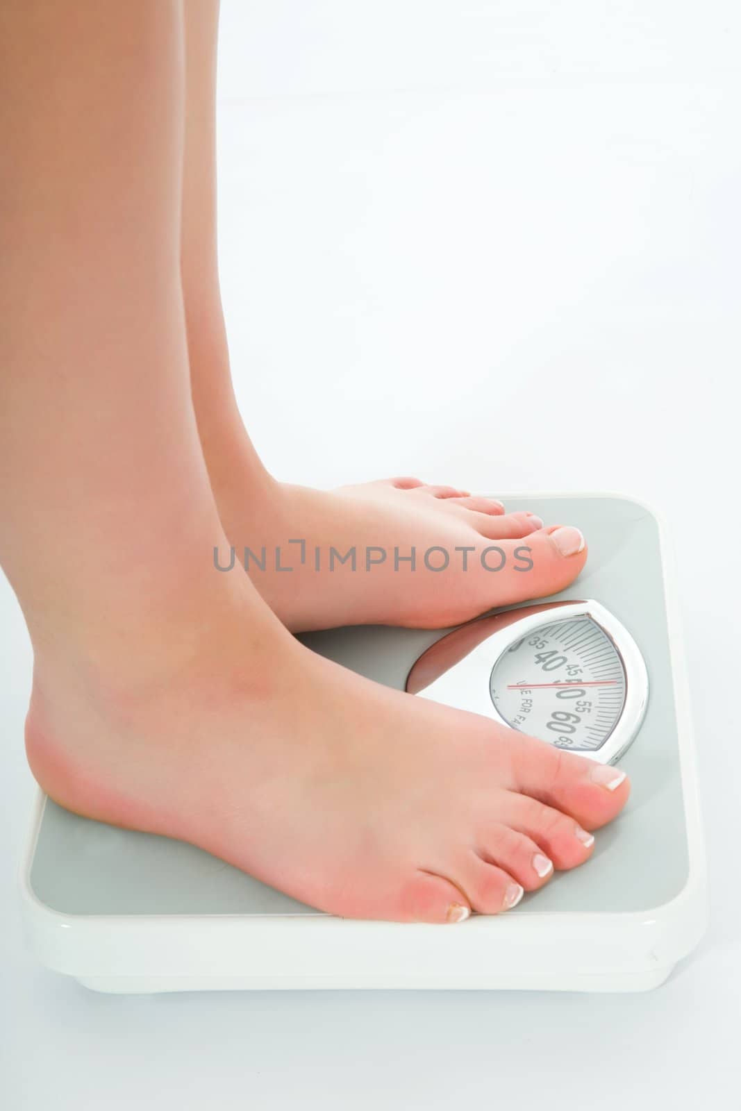 beautiful woman legs with  scales on white