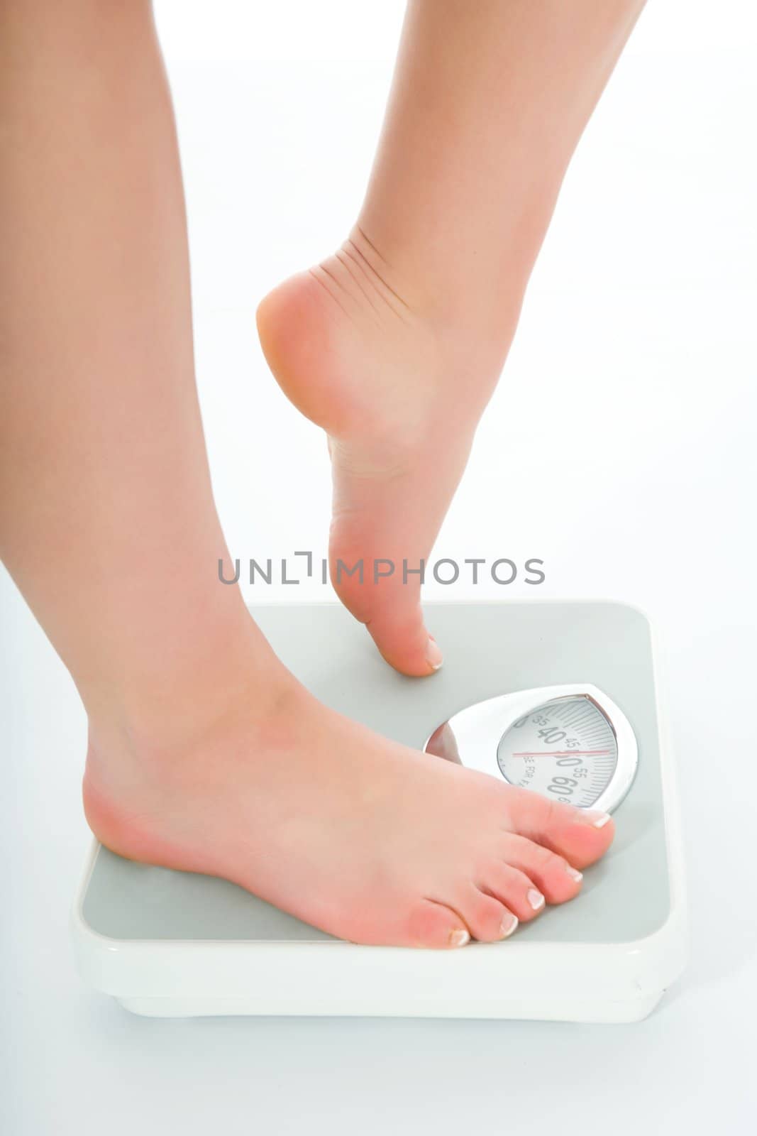 beautiful woman legs with  scales on white