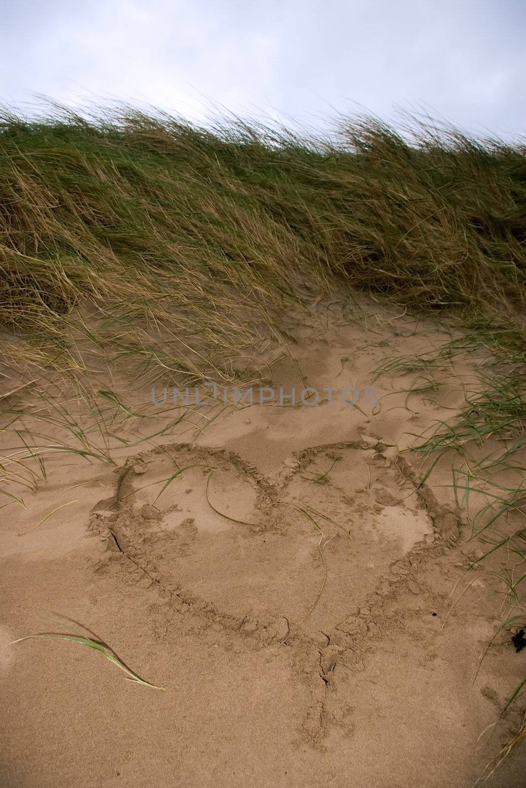 a love heart written in the sand on the west coast of ireland near ballybunion