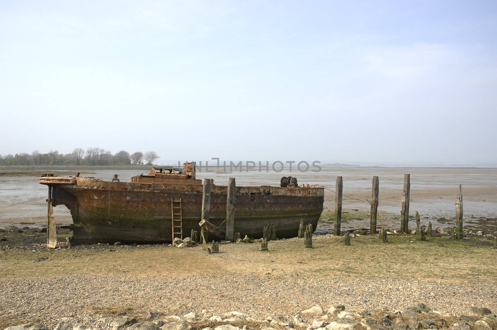 An old abandoned river barge on the river medway in kent , England