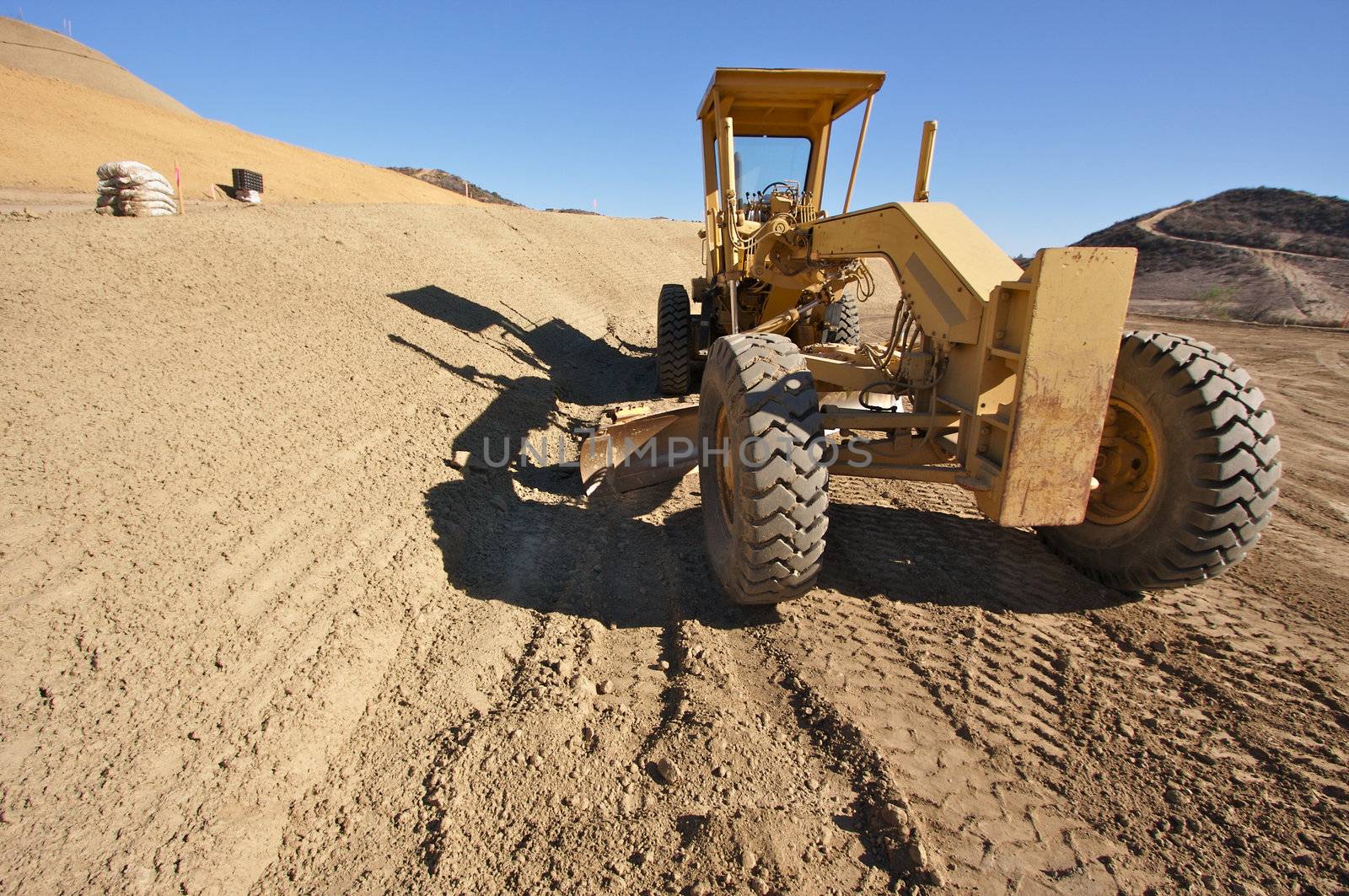 Tractor at a Cunstruction Site and dirt lot.