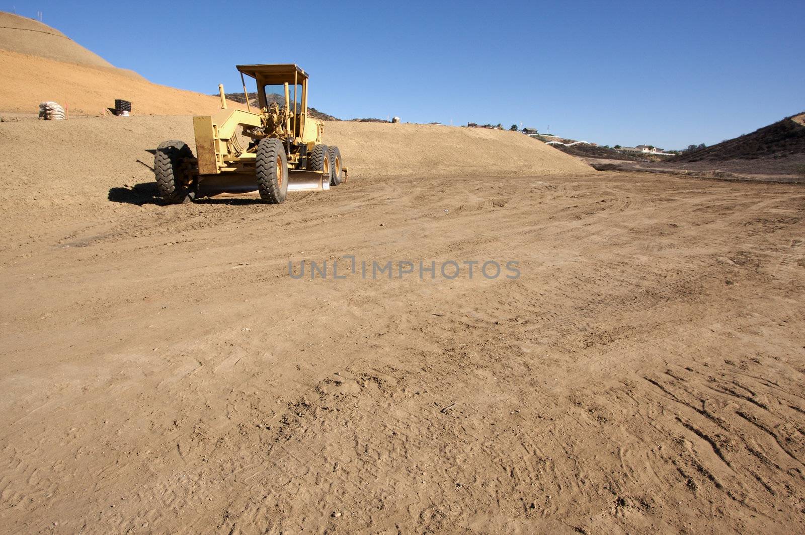 Tractor at a Cunstruction Site and dirt lot.