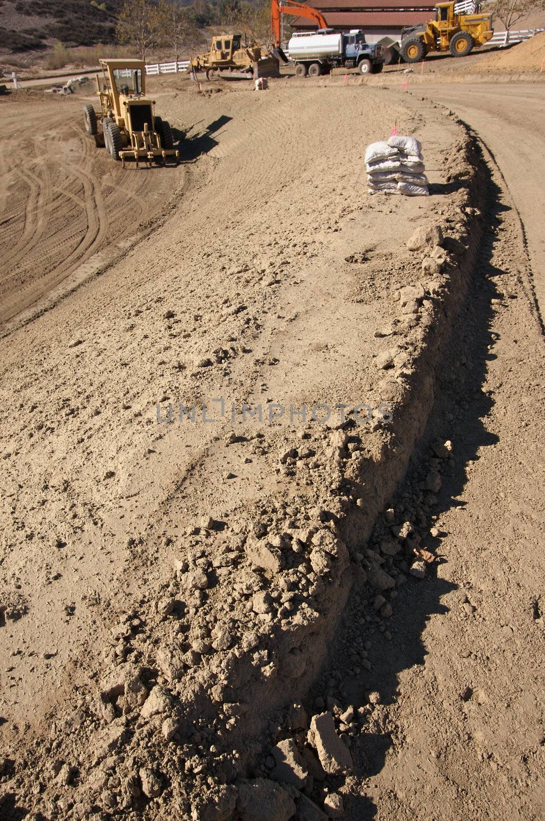 Sandbags & Machinery at Cunstruction Site by Feverpitched