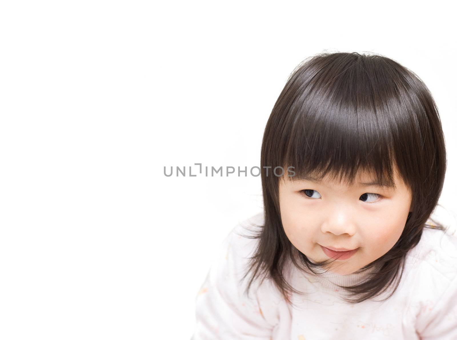Sly Asian girl portrait with funny face.