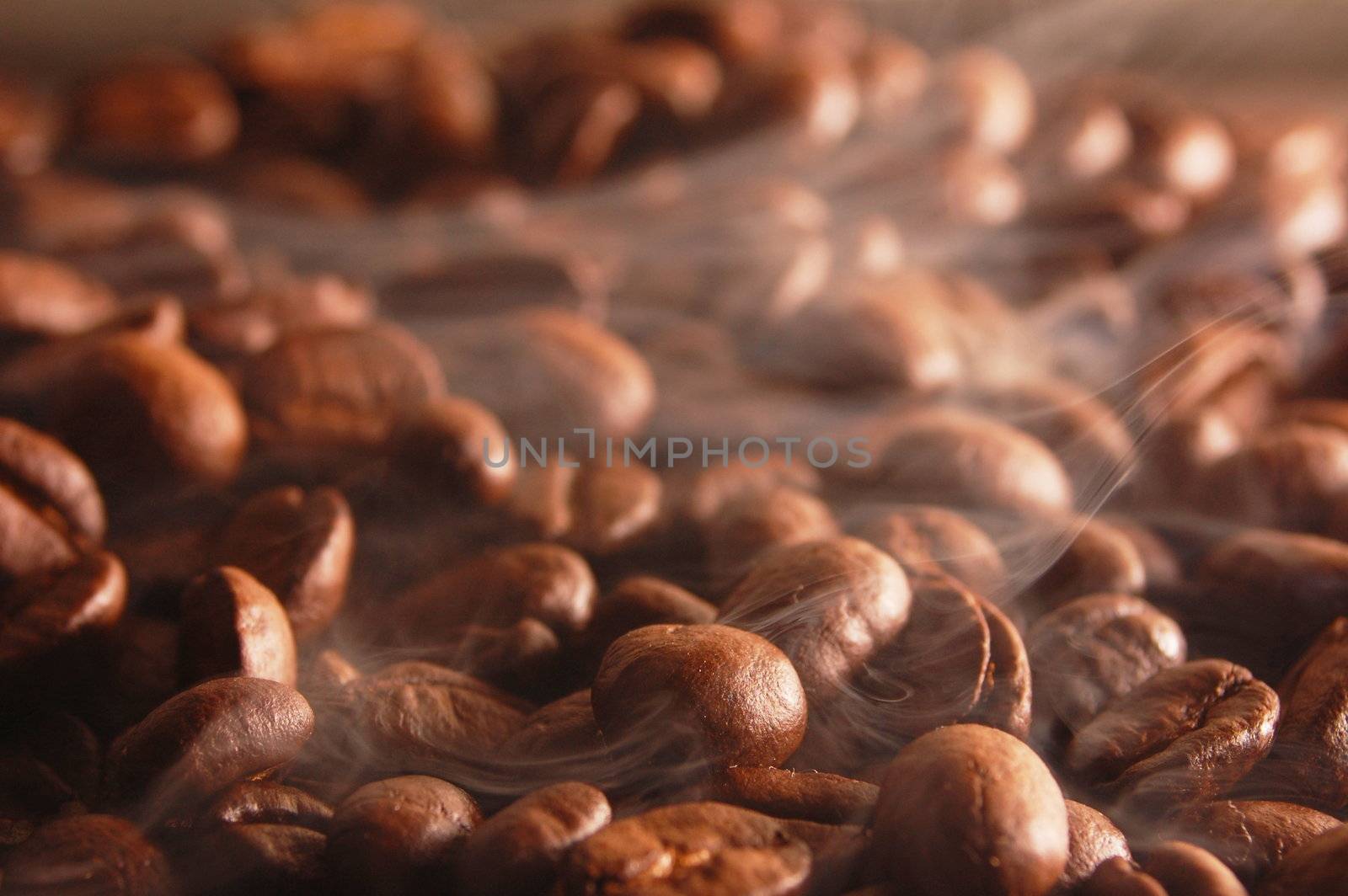 roasting coffee beans with steam and smoke