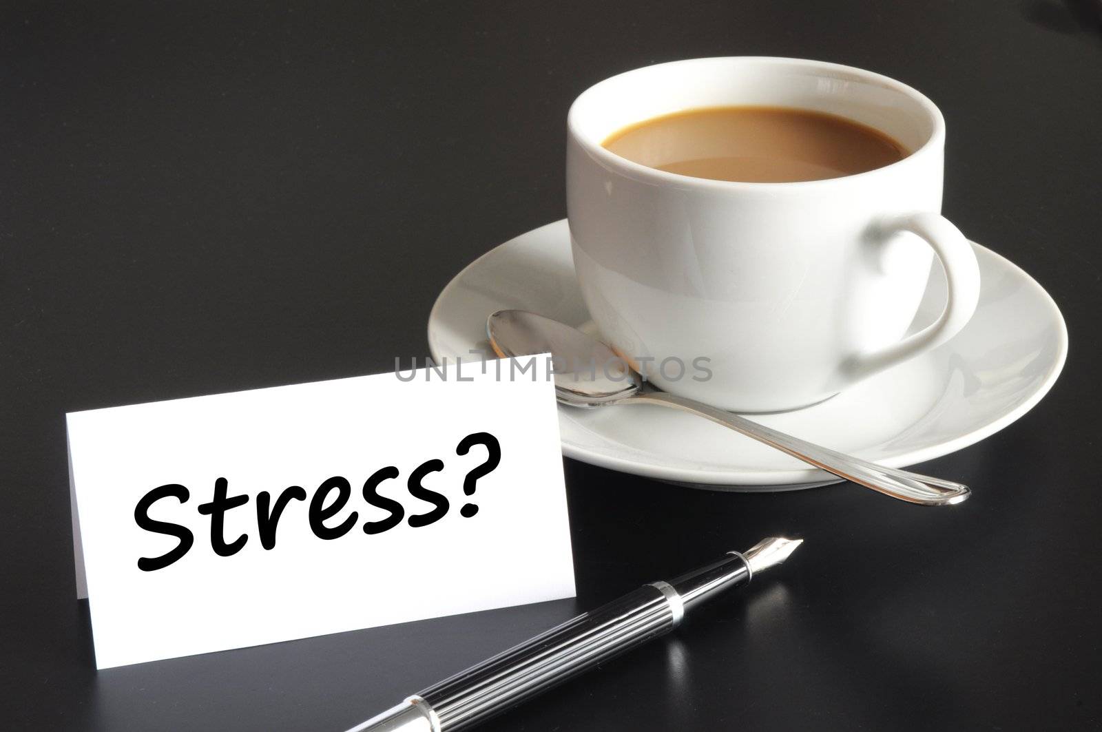 stress in business office concept with cup of coffee on black background