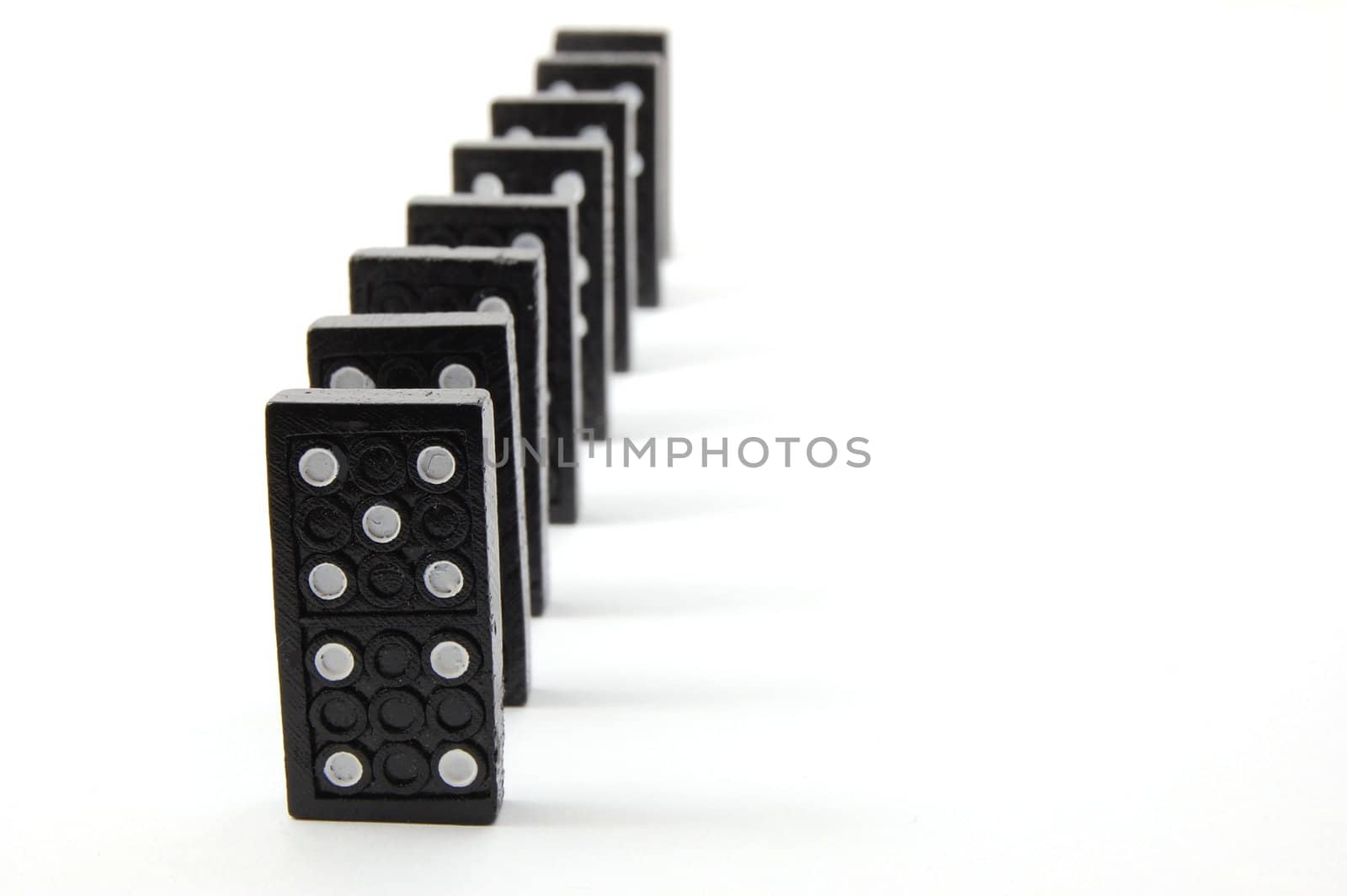 chain of dominoes isolated on a white background