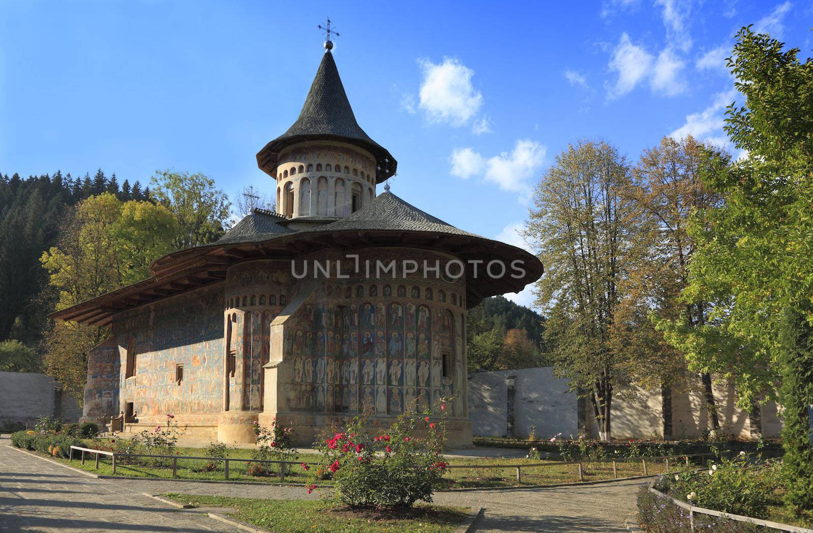 Image of Voronet Monastery,Moldavia,Romania.The frescoes at Voronet feature an intense shade of blue known in Romania as "Voronet blue".It was built in 1488 by Stephen the Great and is one of the most famous painted monasteries from Moldavia.