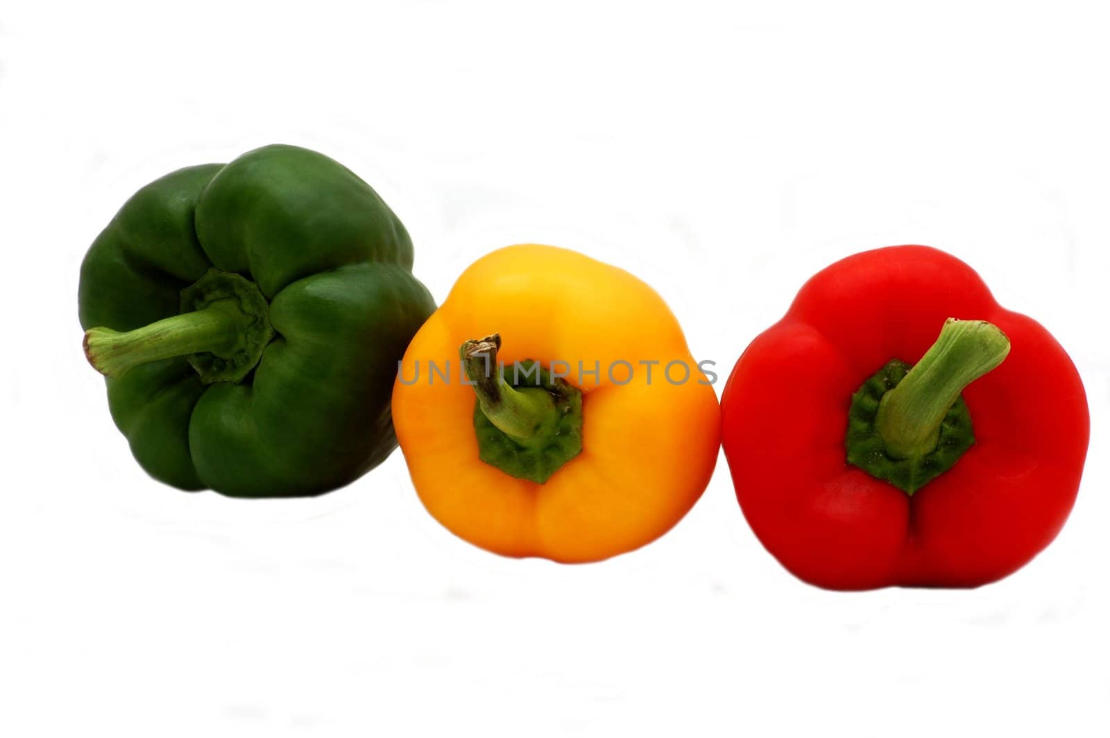 three colored peppers isolated on the white background