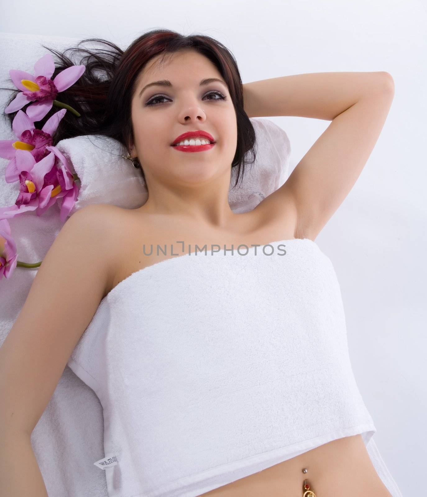 Attractive woman getting spa treatment on white