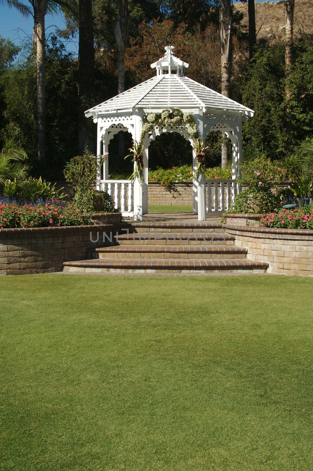 Elegant Wedding Gazebo with Steps and Lush Grass.