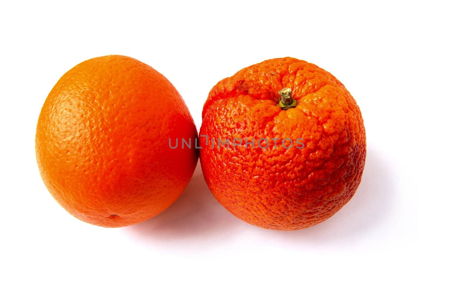 colored oranges, one have rough surface pattern, isolated on white with shadows