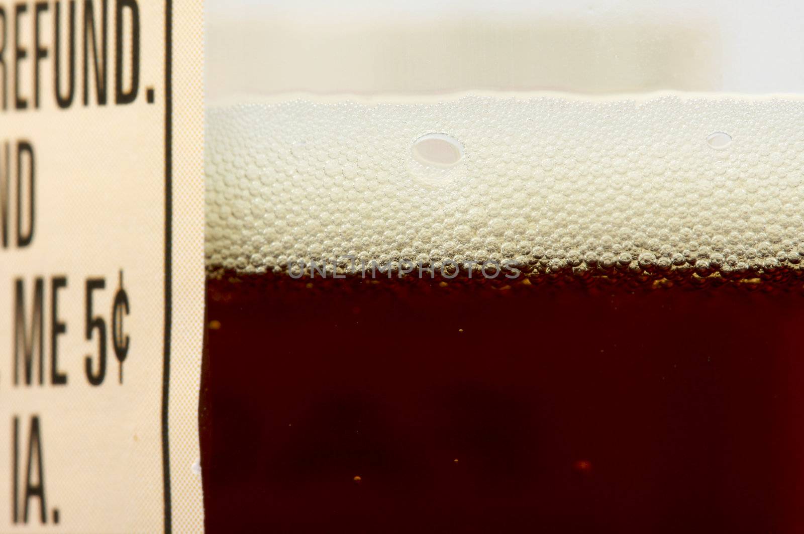 Close-up of a dark beer bottle and label.