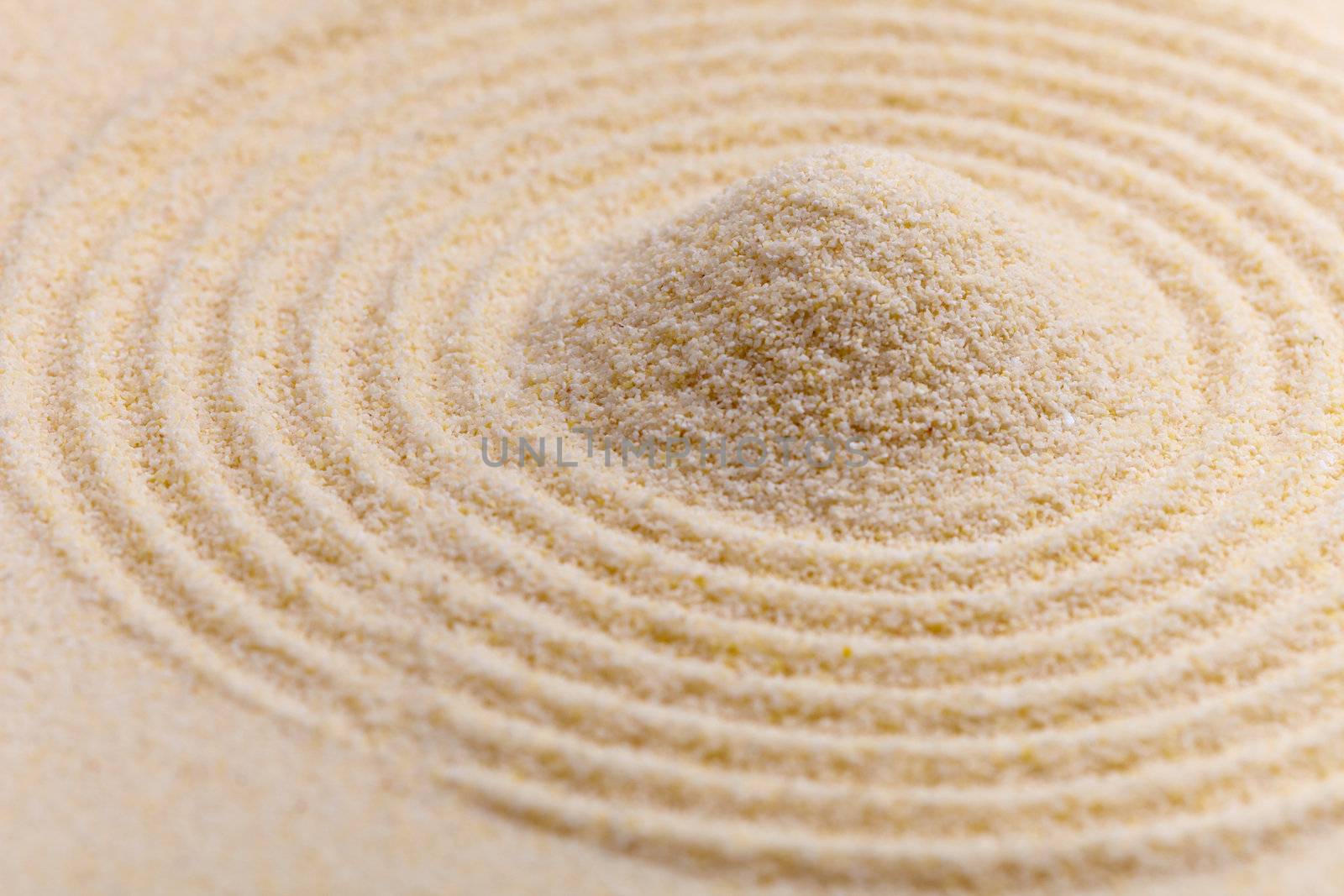 Abstract composition of fine yellow sand with circles