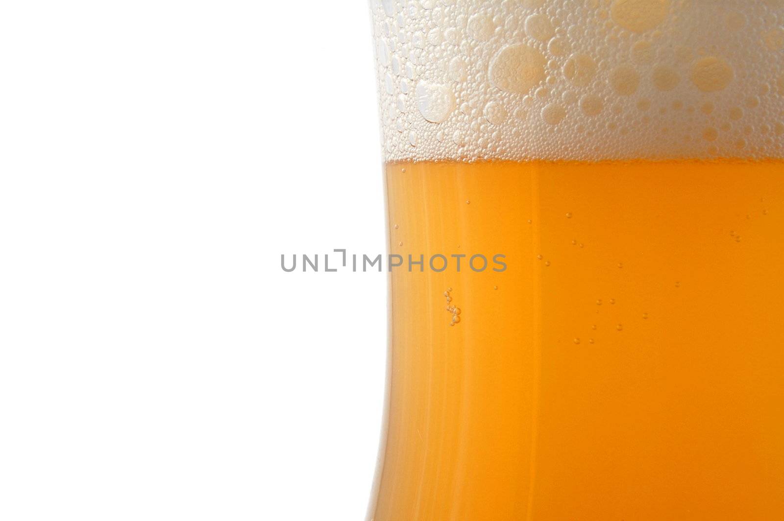 glass of german beer with foam foam and bubbles