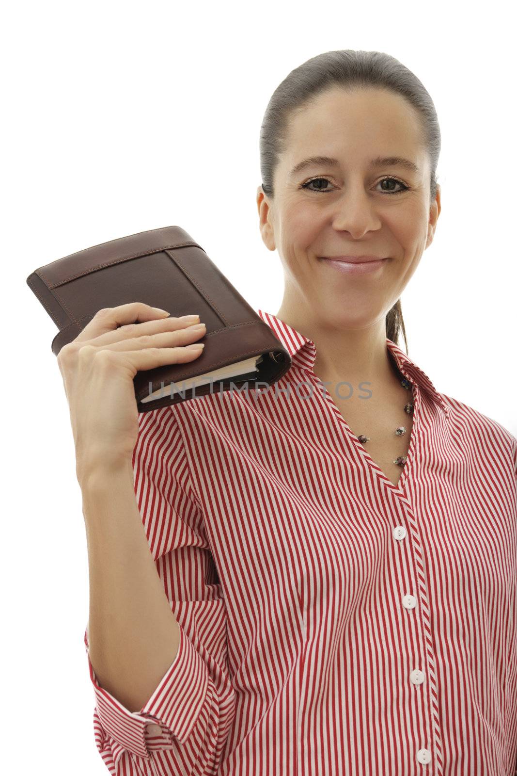 Attractive middle aged business woman holding a brown organizer on a white background