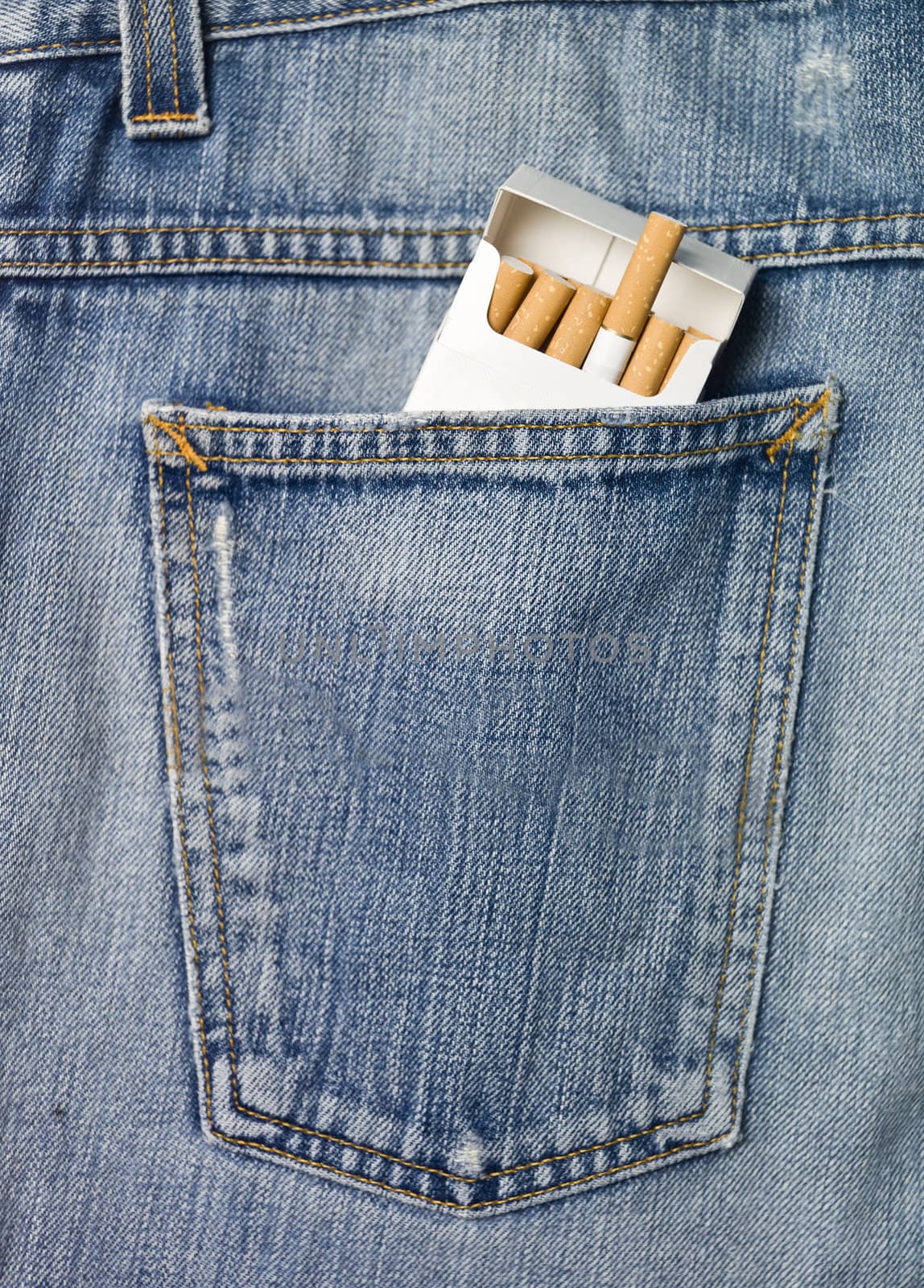 Jeans pocket with a packet of cigarettes