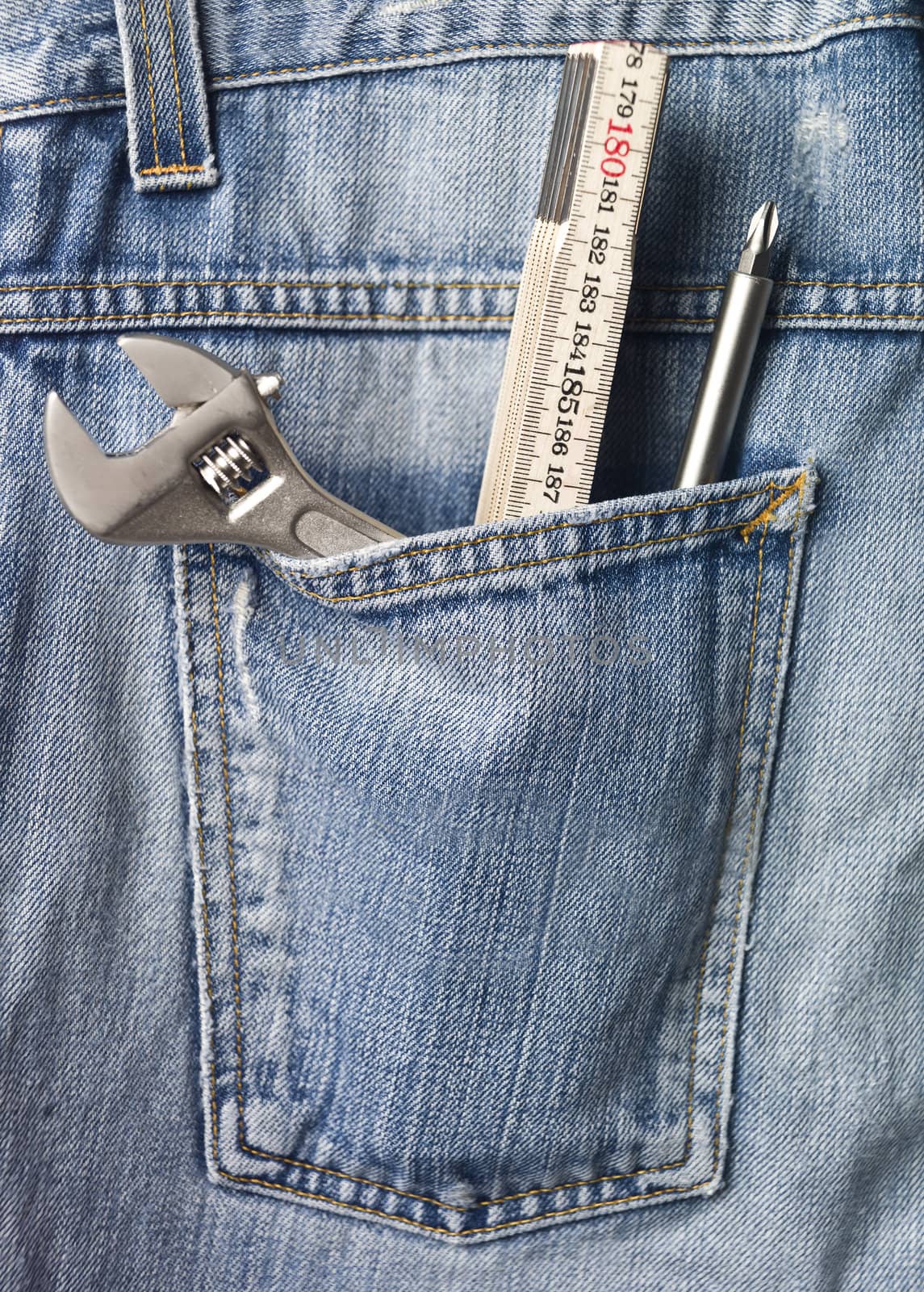 Tools in back pocket of a pair of jeans