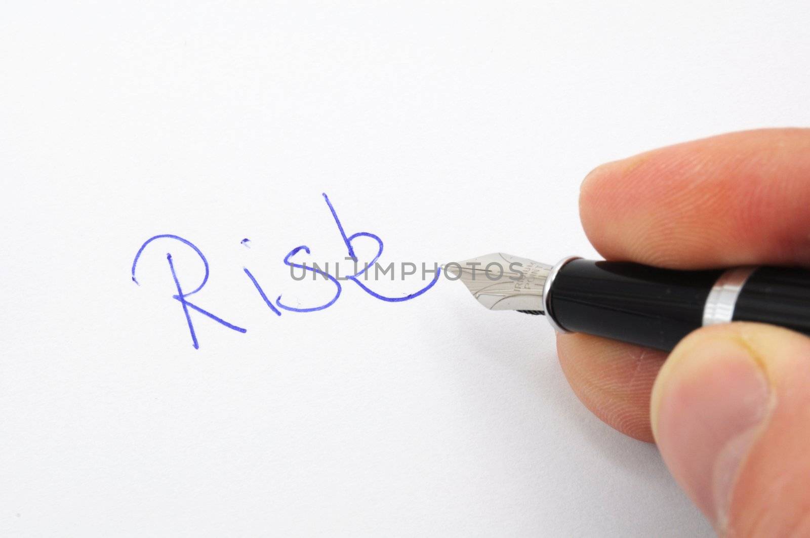 risk management concept with word on paper and pen