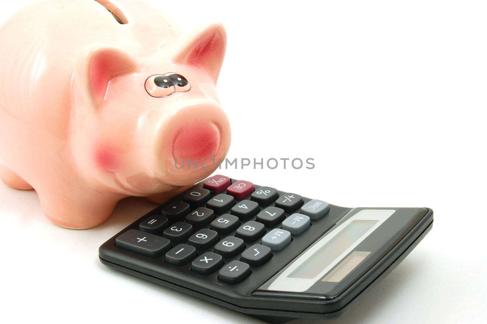 saving money with a piggy bank isolated on white