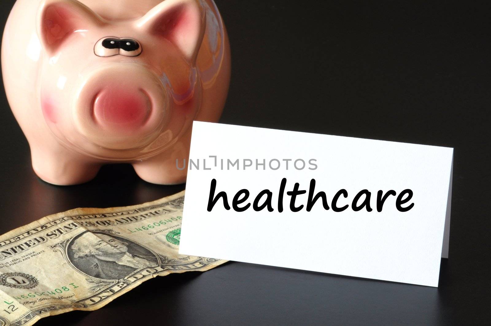 healthcare concept with piggy bank on black background