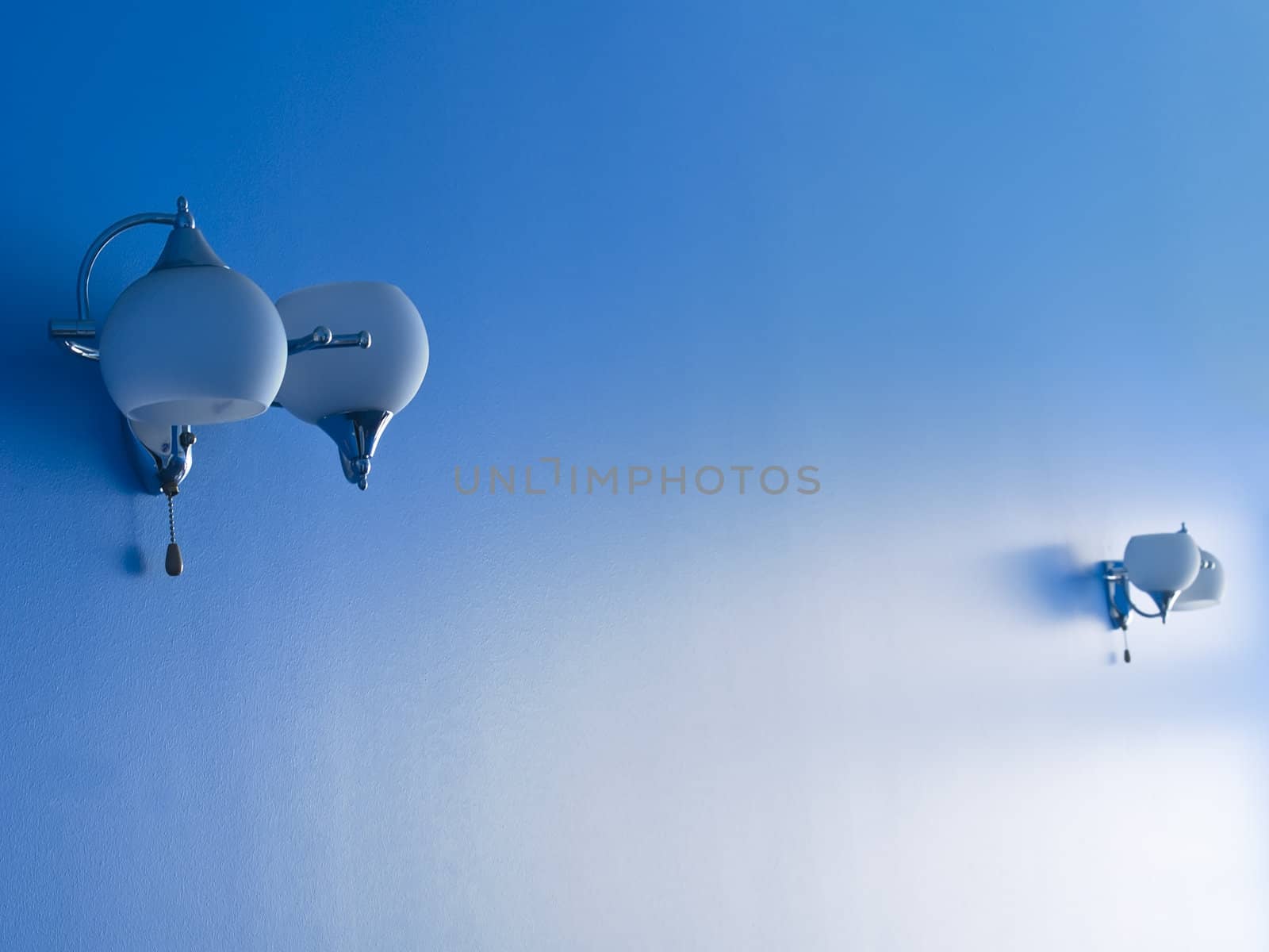 Two lamps on a blue wall by kvinoz