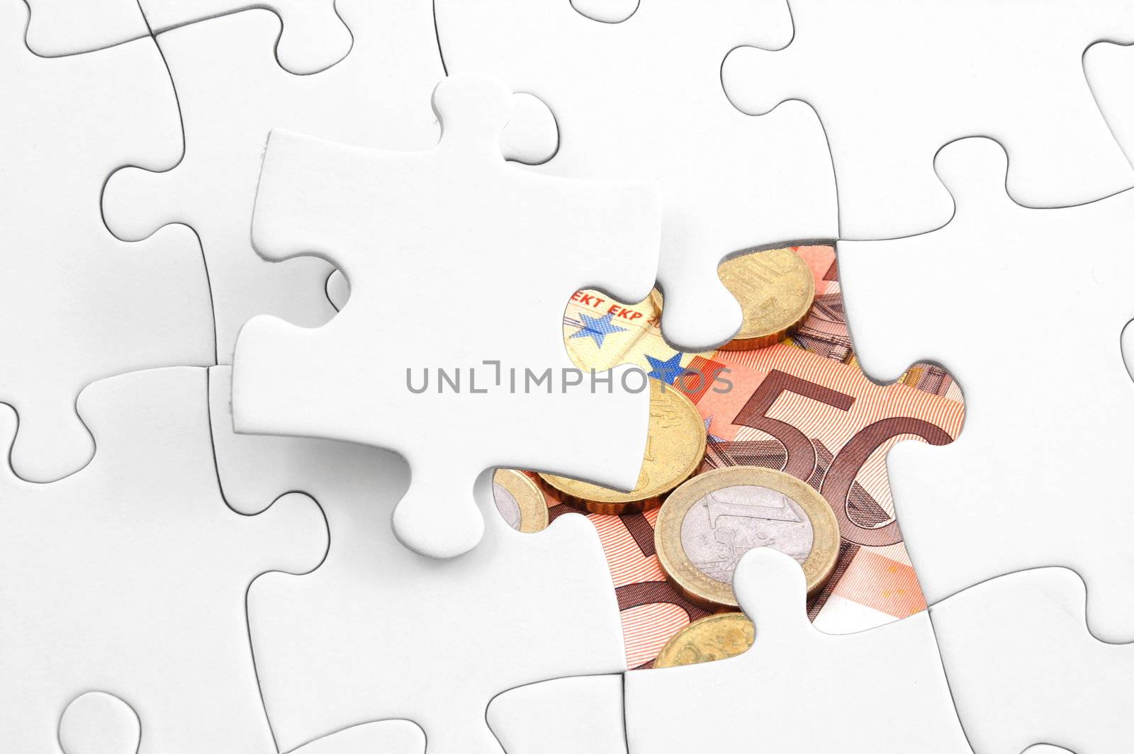 puzzle and money showing business or finance concept