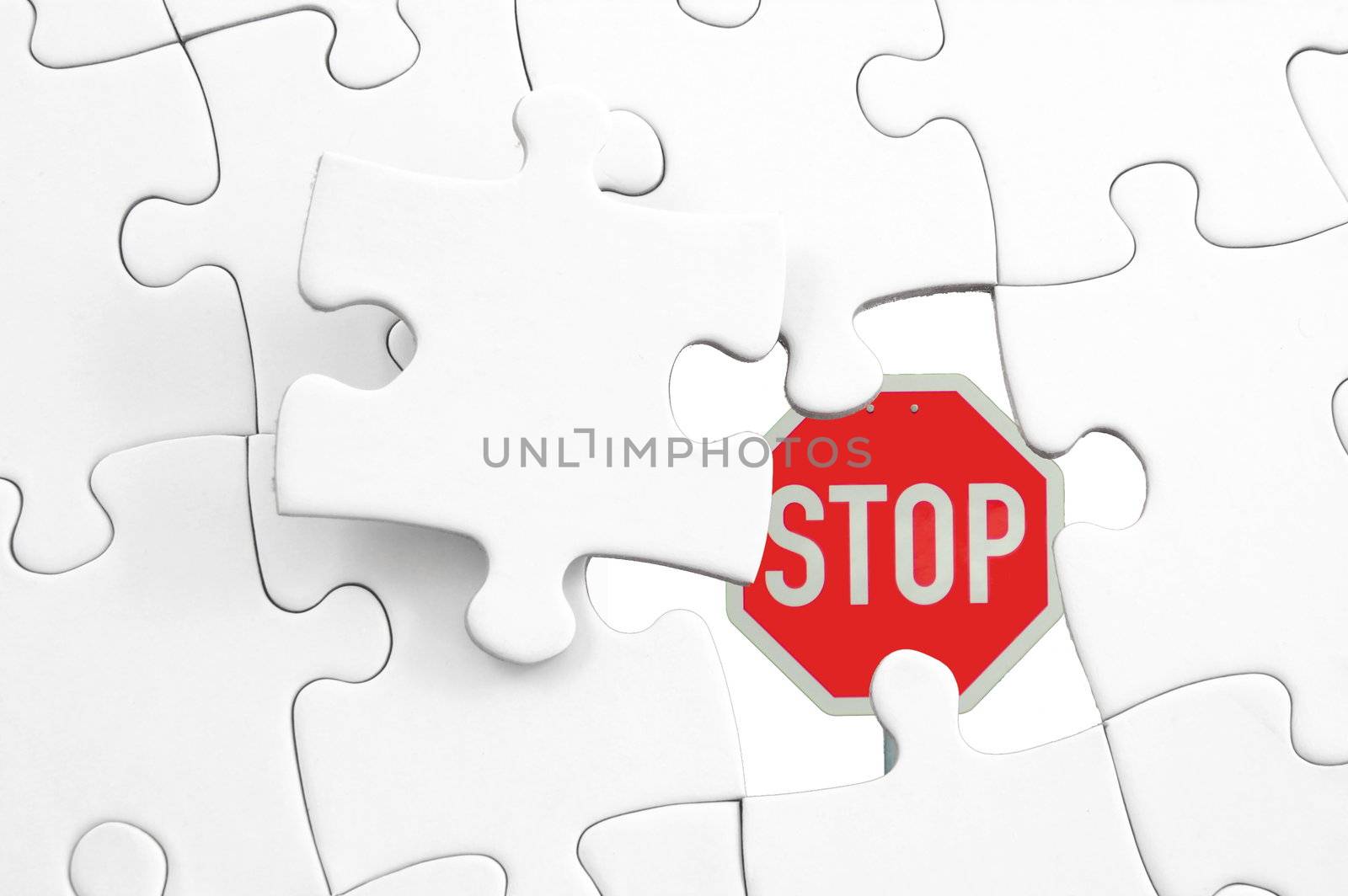 puzzle and stop sign showing business concept