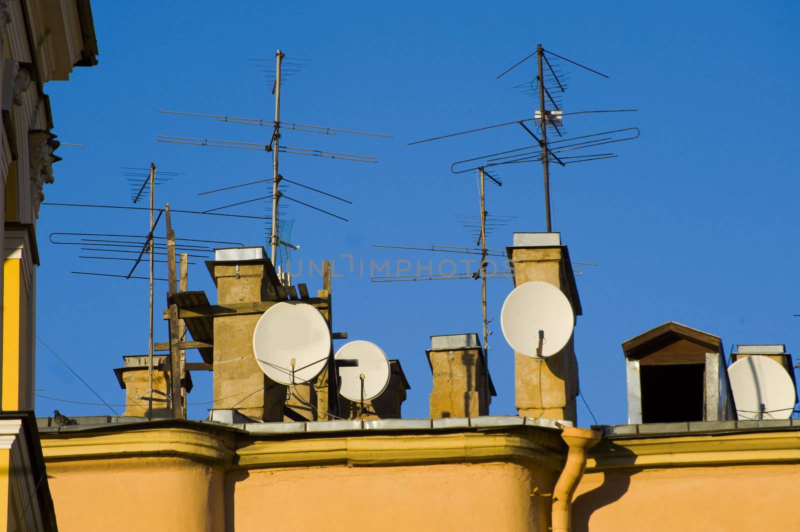 TV antennas on the building roof in St.Petersburg, Russia