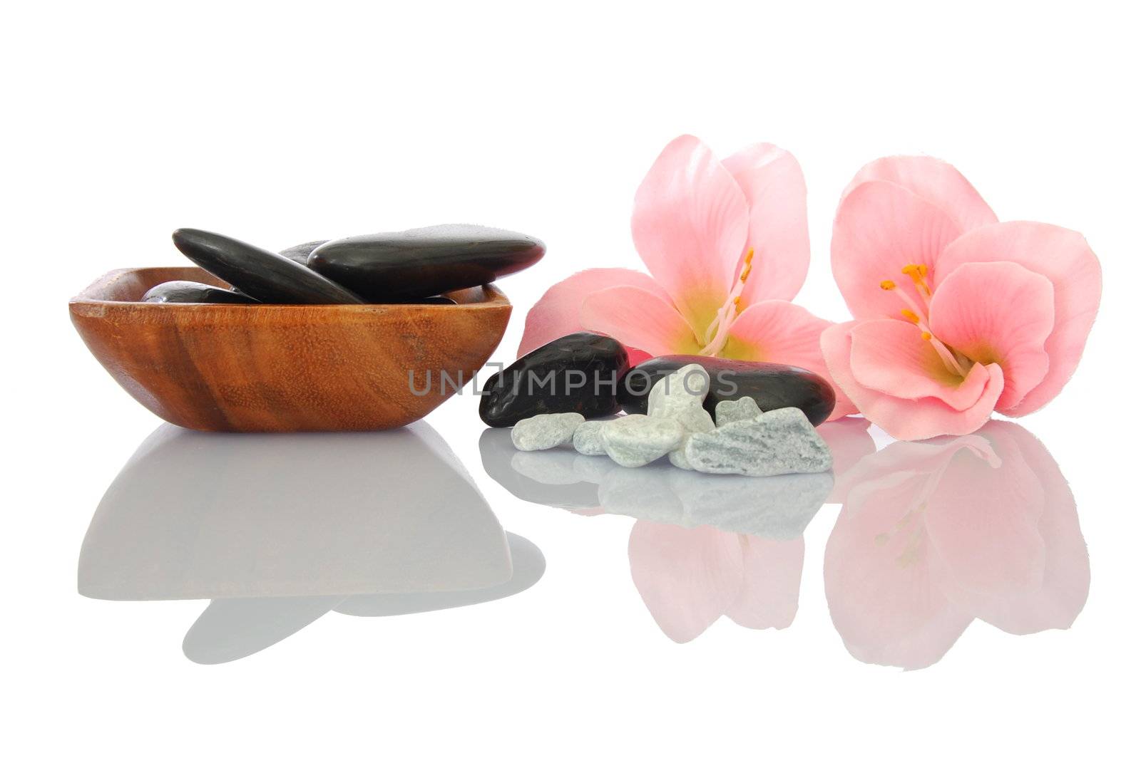 wellness zen and spa still life with flower towel and pebbles isolated on white