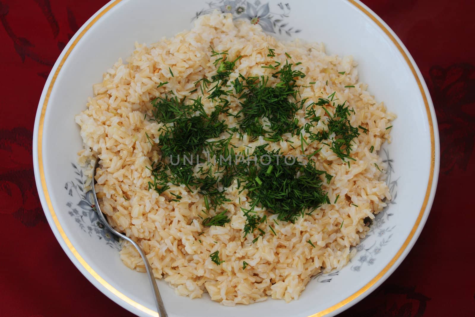 Brown rice on the red background