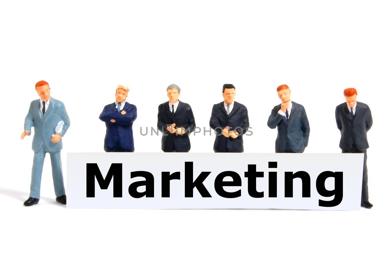 marketing concept with toy business man isolated on white background