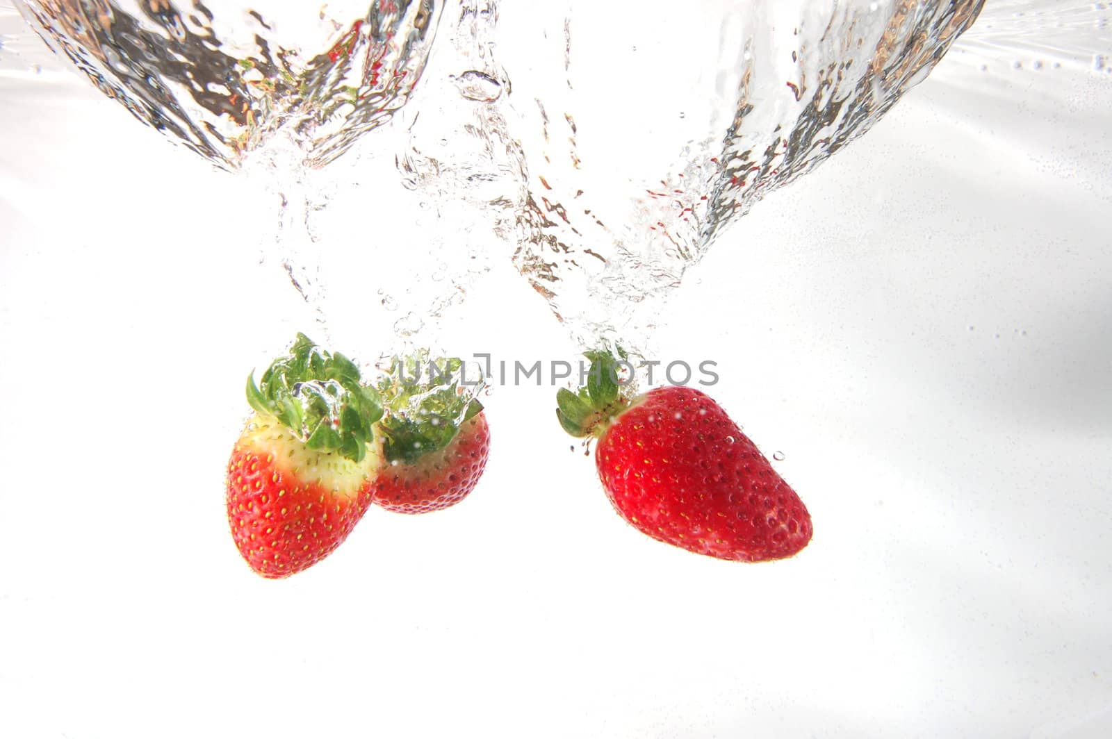 strawberry splash in water showing a fitness concept