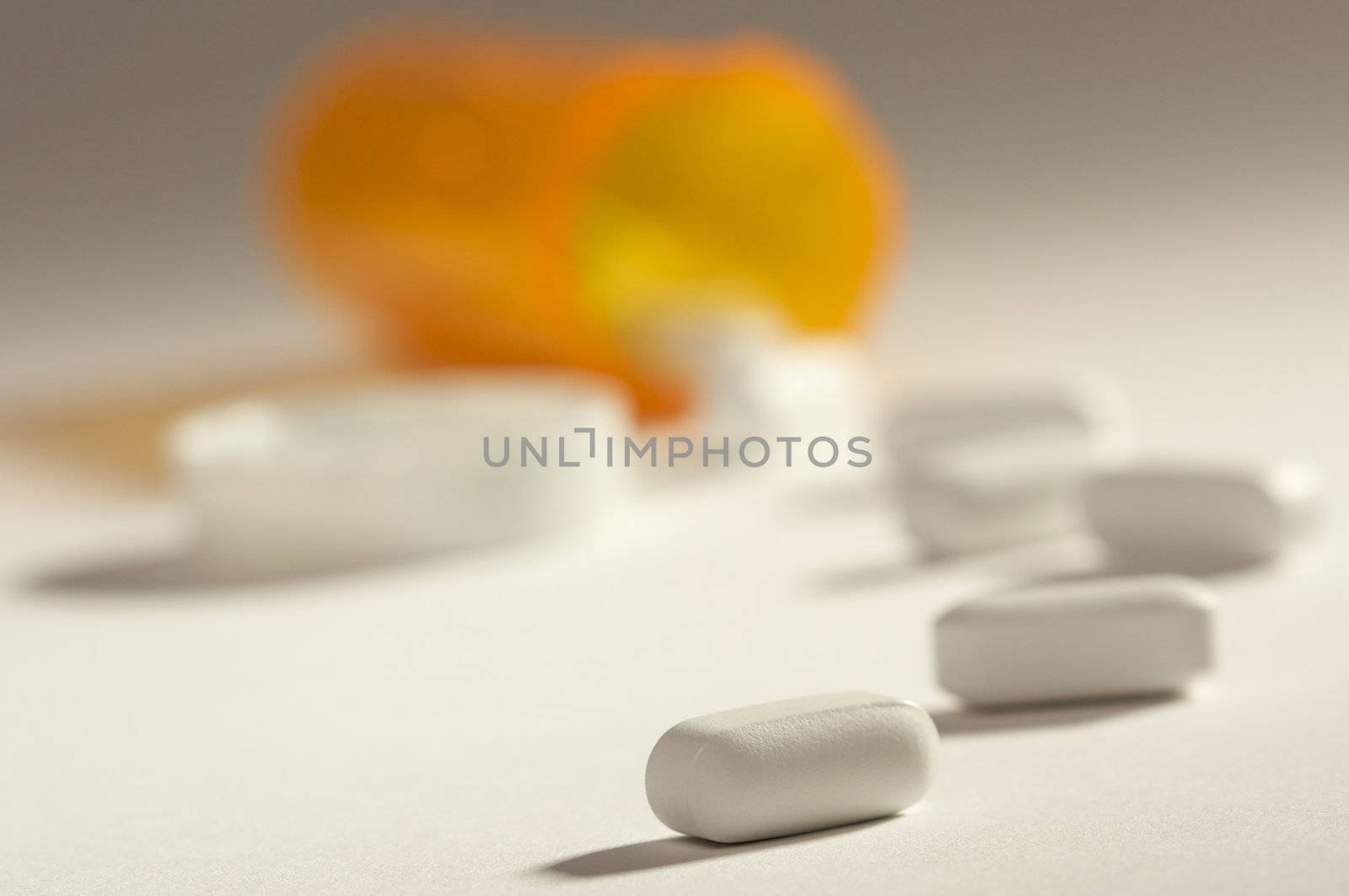 Pills and Fallen Bottle with Dramatic Lighting.