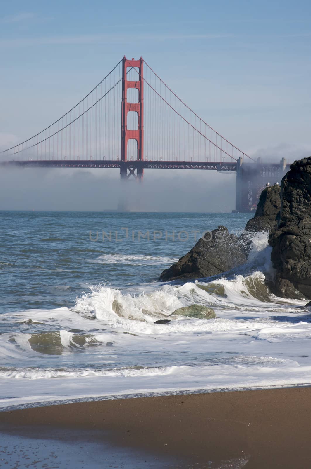 The Golden Gate Bridge in the early morning fog. San Francisco, California, United States.