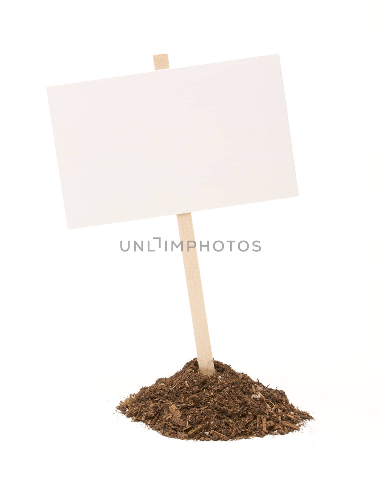 Blank white sign in mount of dirt isolated on a white background.