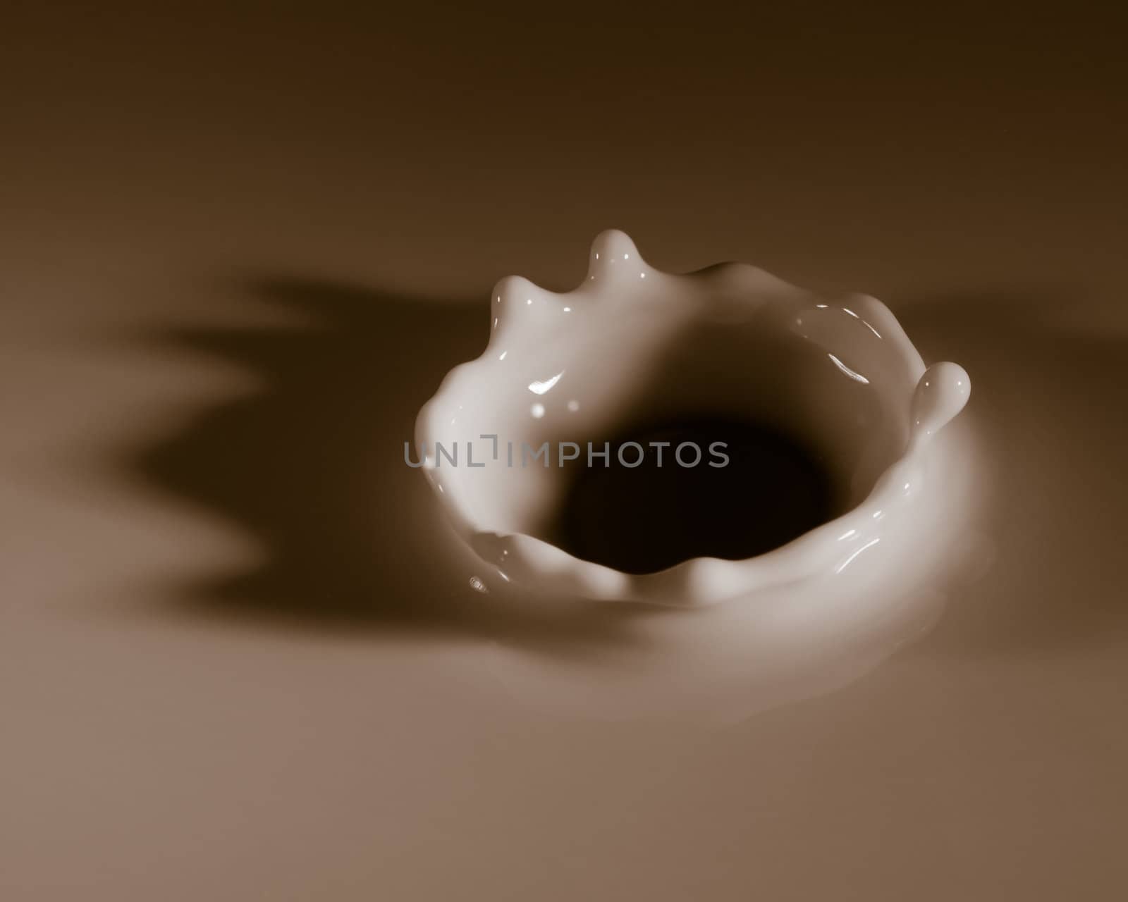 Abstract photos of milk droplets falling and captured on impact