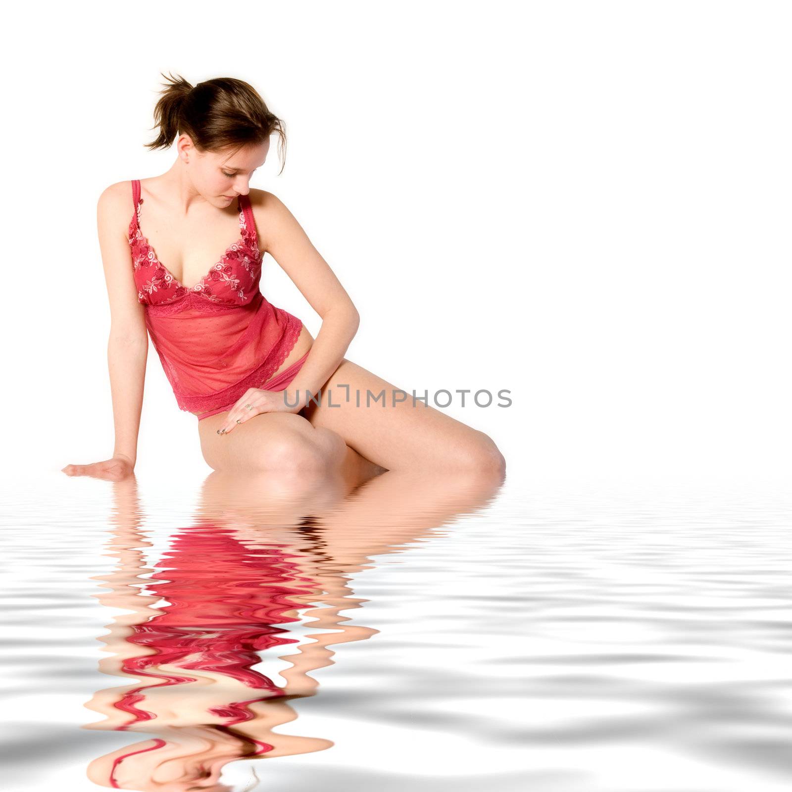 Woman in red lingerie looking down in water by DNFStyle