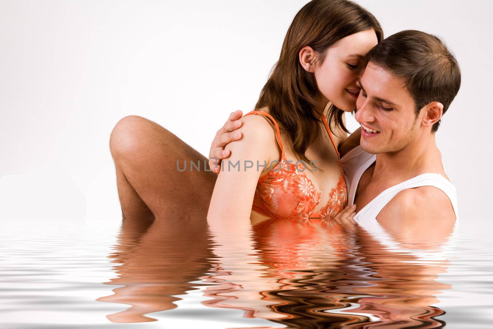 Young adult couple in the studio in a pool