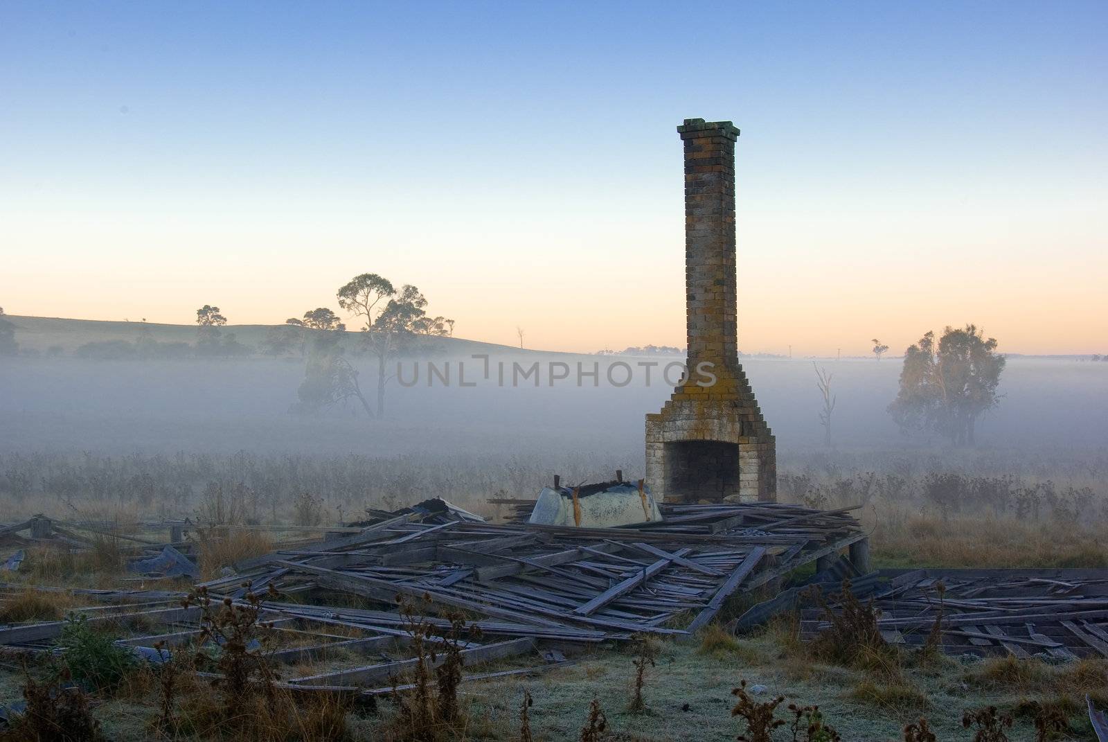 just a chimney and bathtub of this fallen down house